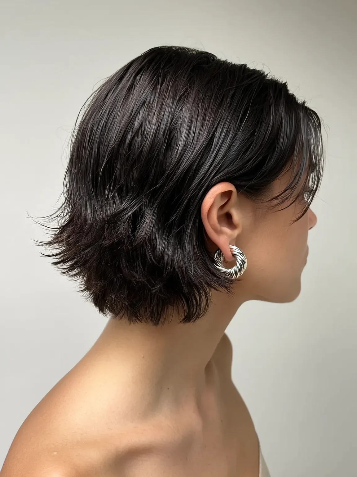 Wavy Textured Espresso Bob with Side-Swept Bangs